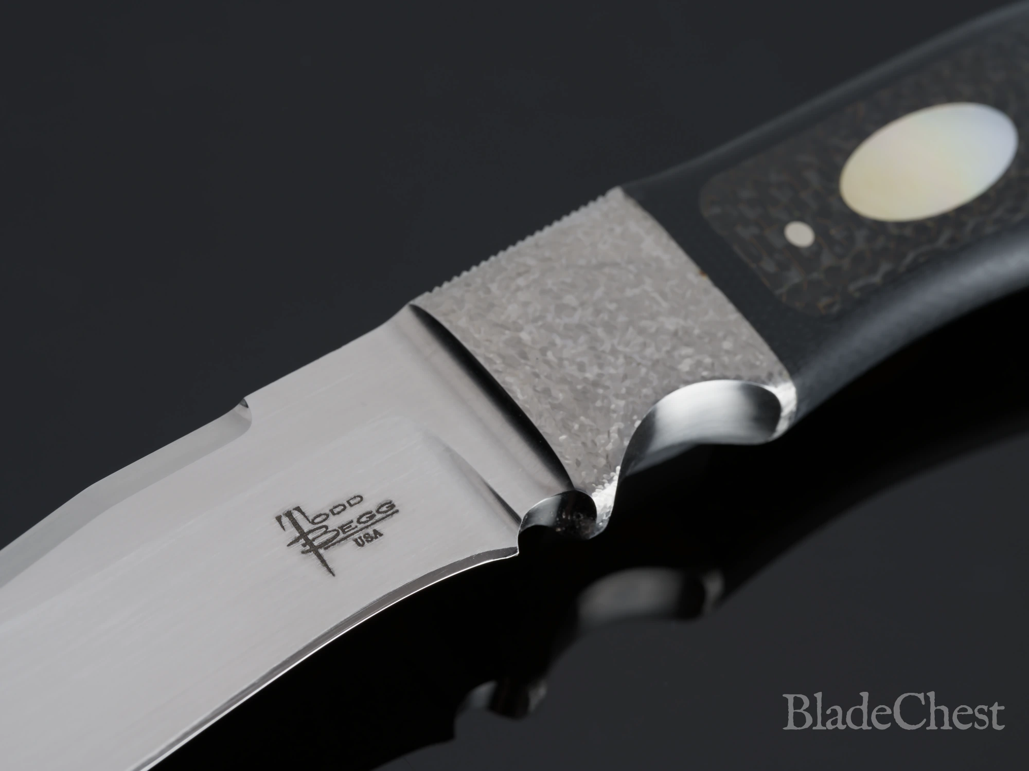 Todd Begg Integral Fixed Blade &mdash; the integral guard, thumb rest, and gold-lip pearl