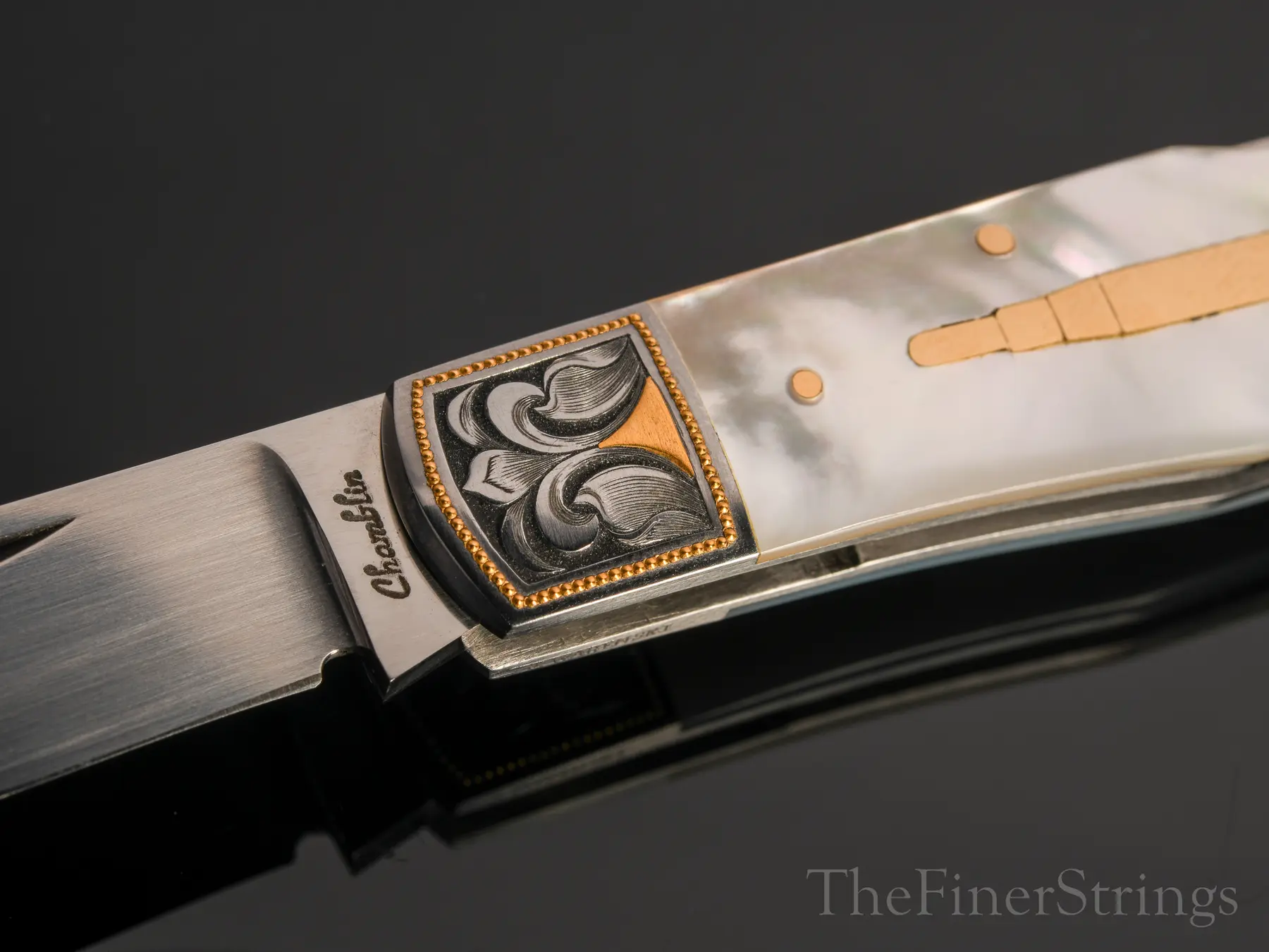 Bolster detail — Chamblin signature and Warenski engraving
