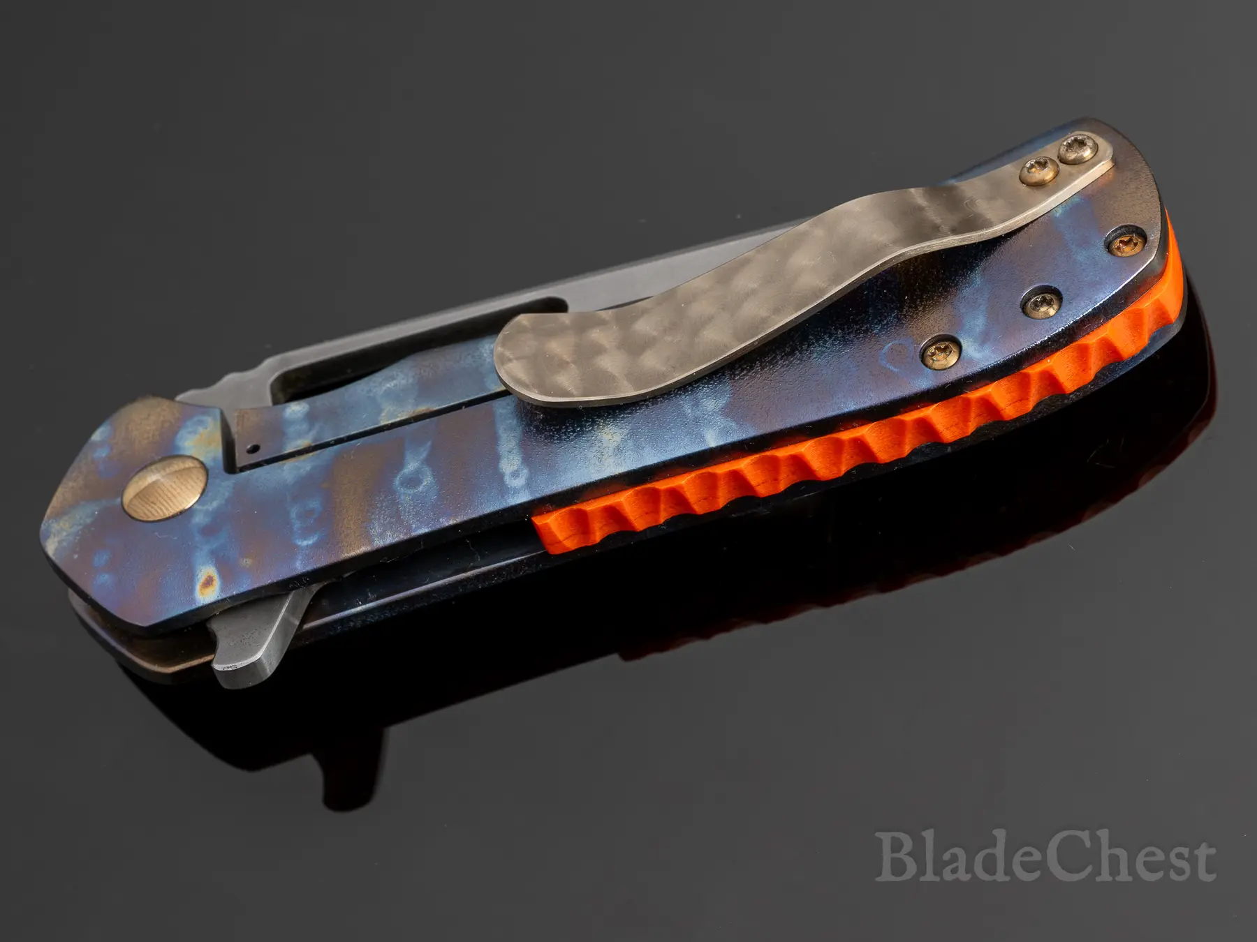 Closed — clip side, orange G10