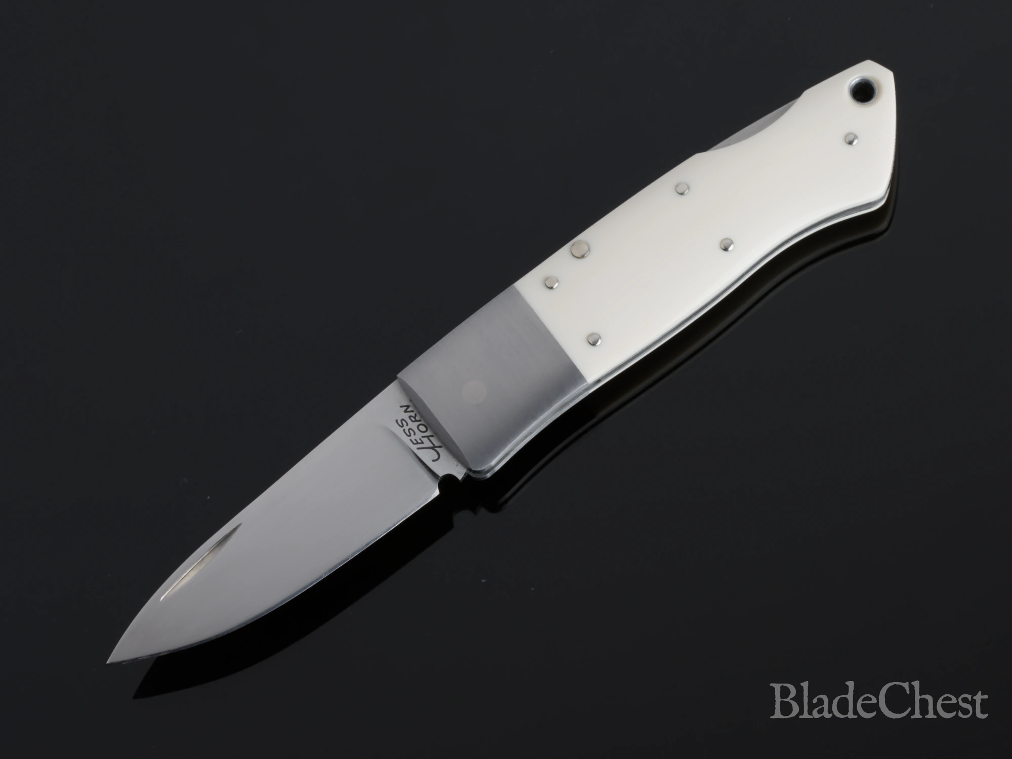 Jess Horn mammoth ivory lockback &mdash; open, satin blade and reflection