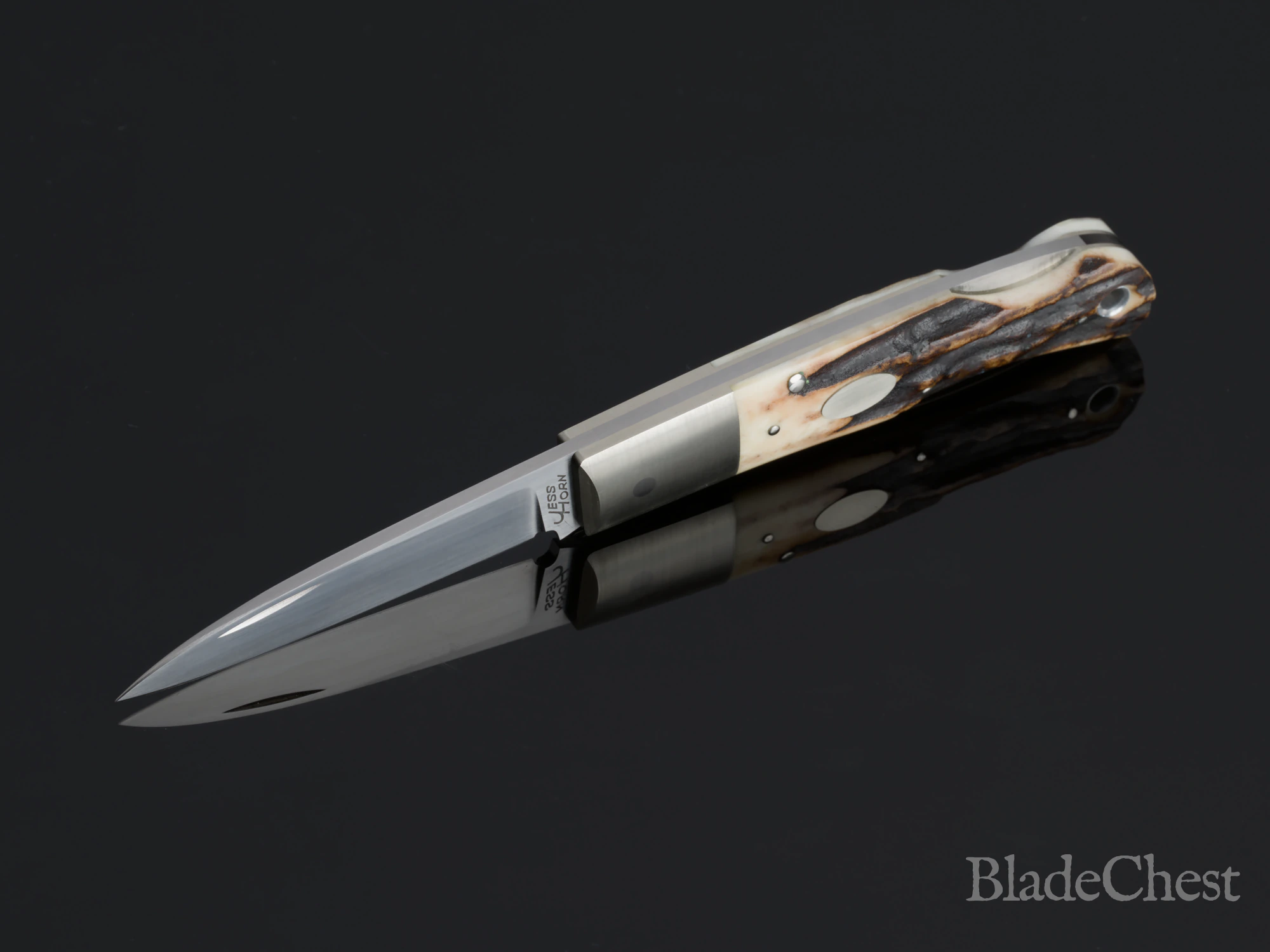 Jess Horn stag folder &mdash; open, dramatic receding angle