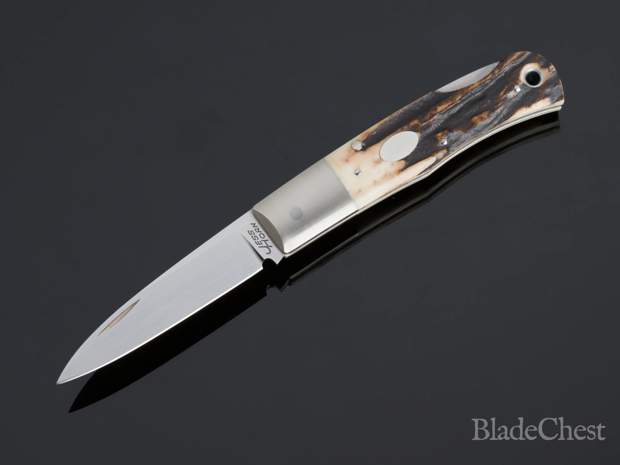 Jess Horn stag folder &mdash; open profile, stag and escutcheon