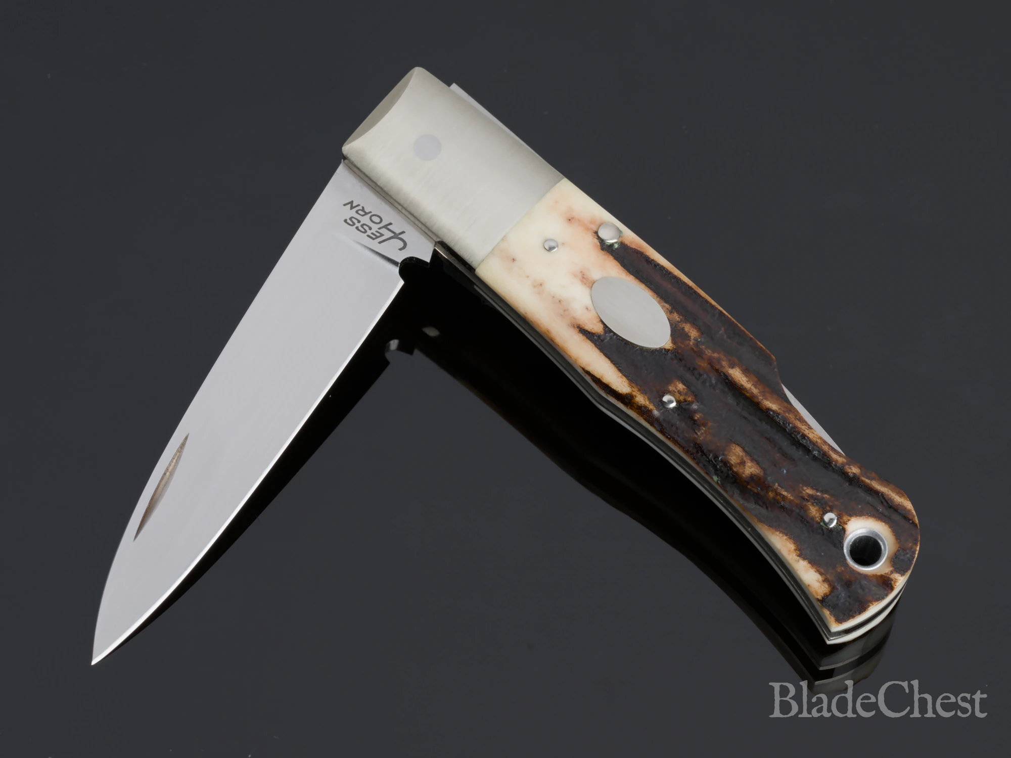 Jess Horn stag folder &mdash; half-open, showing the joint