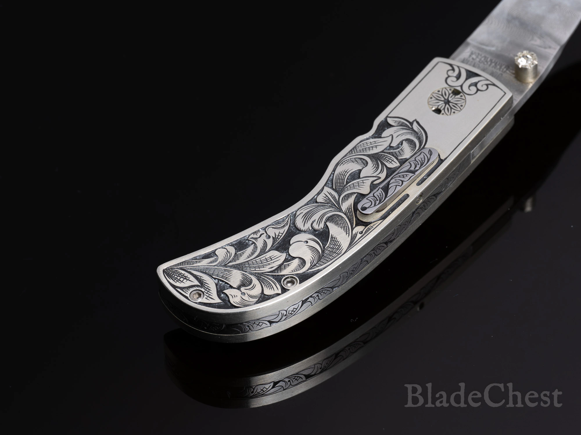 Jim Martin auto &mdash; scroll-engraved handle, closed