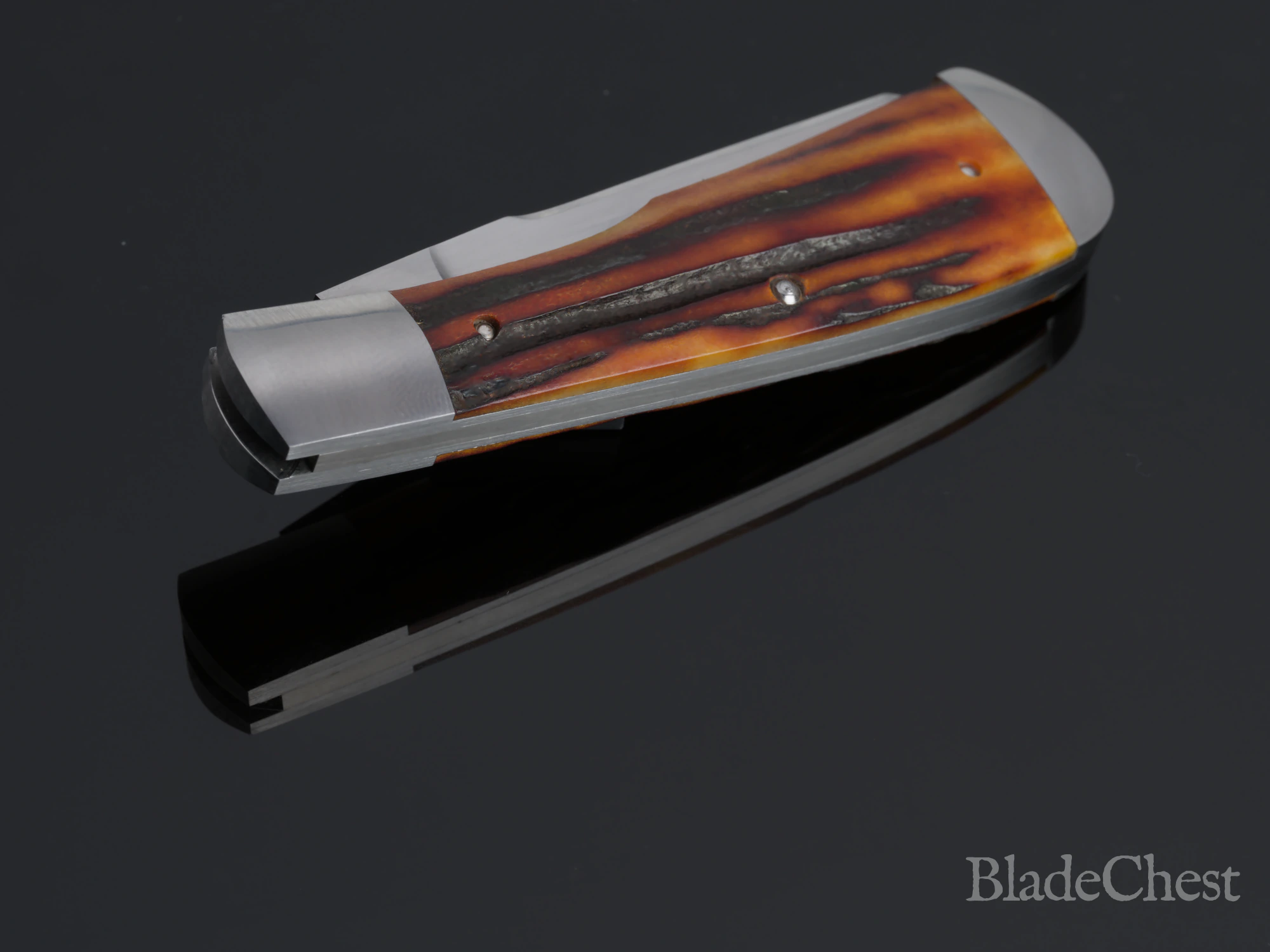 Ben Kabisch Gunstock Stag &mdash; closed, gunstock-curve profile from the reverse