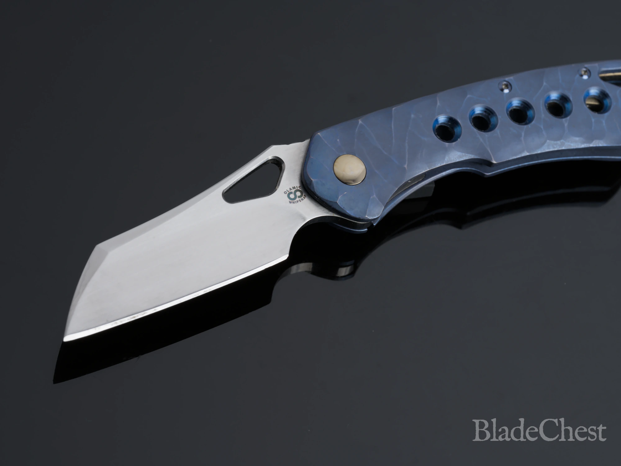 Olamic Whippersnapper &mdash; open, satin wharncliffe blade, sculpted blue titanium, blade down-left