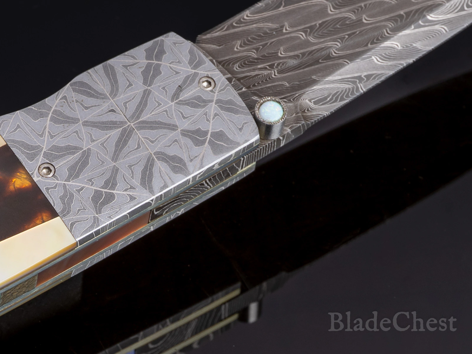 W.D. Pease folder open &mdash; opal-set thumb stud