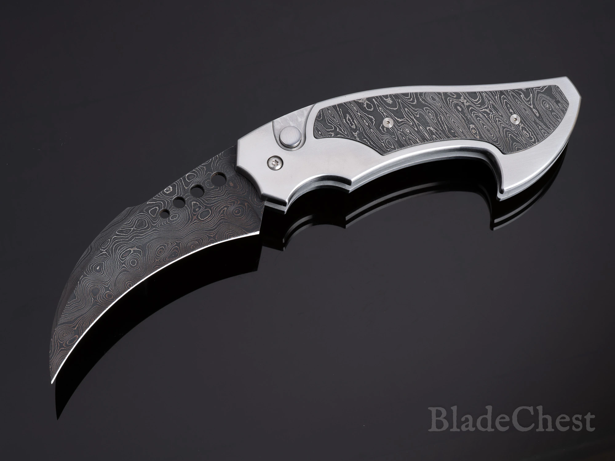 Reese Weiland Damascus automatic folder &mdash; open, curved blade down-left